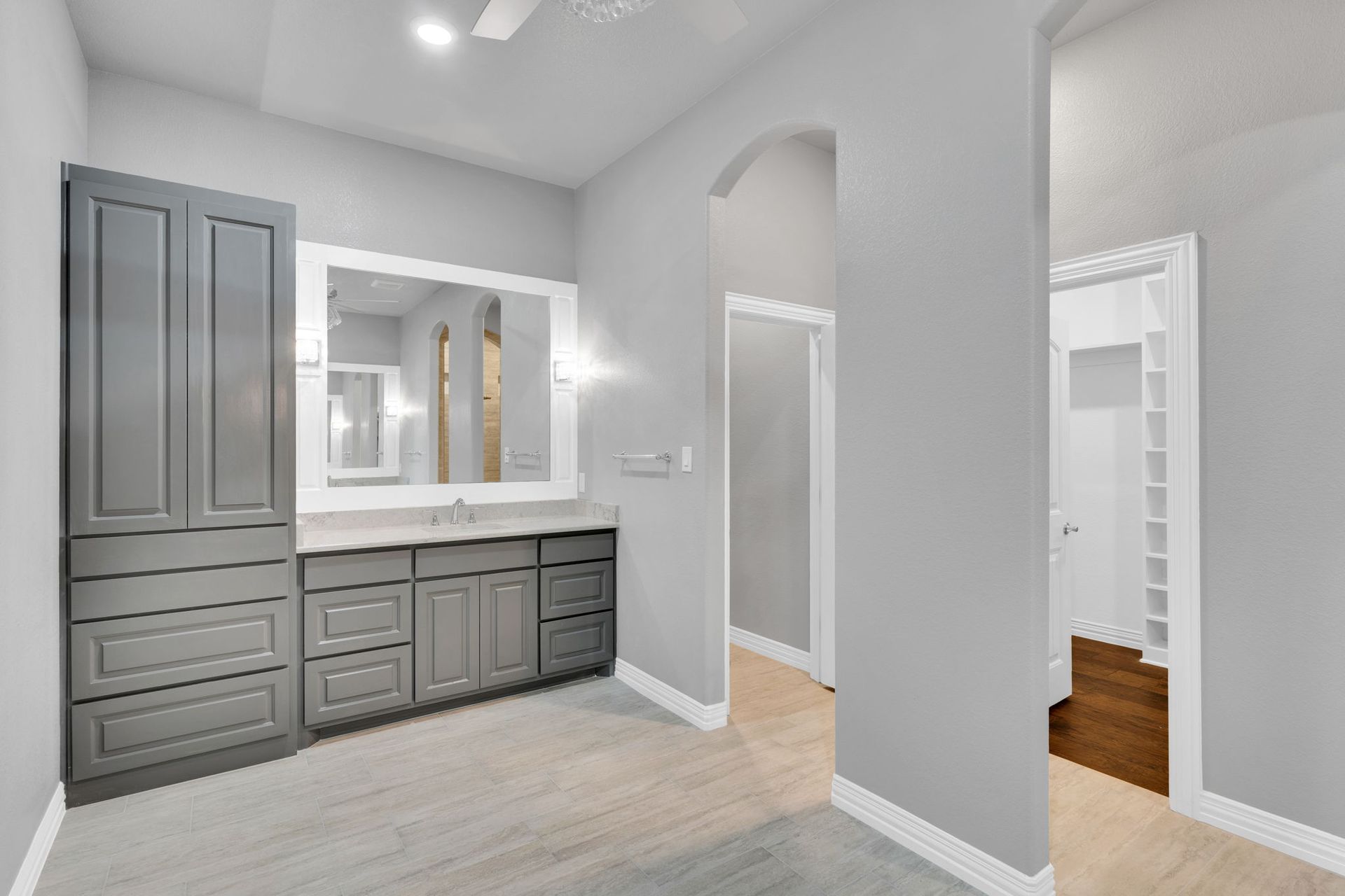bedroom with tray ceiling and modern finishes