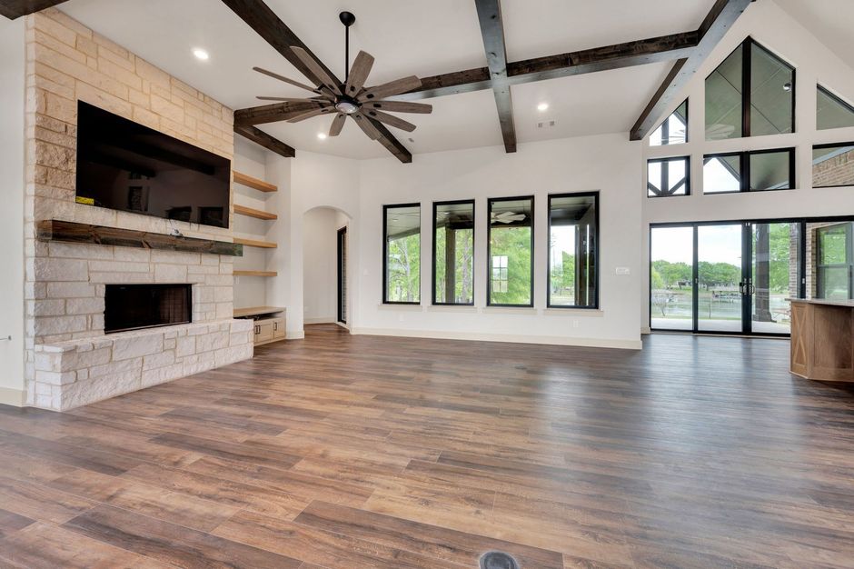 living room with exposed beams and fireplace