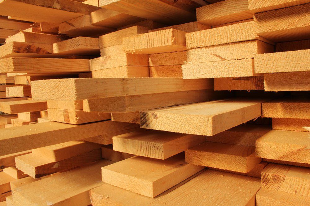 a pile of wood is stacked on top of each other .