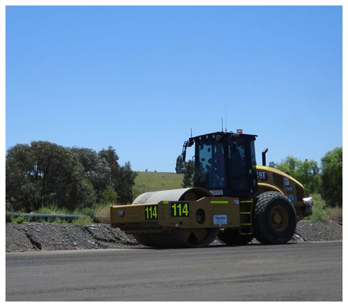 A yellow tractor with the number 114 on the side of it