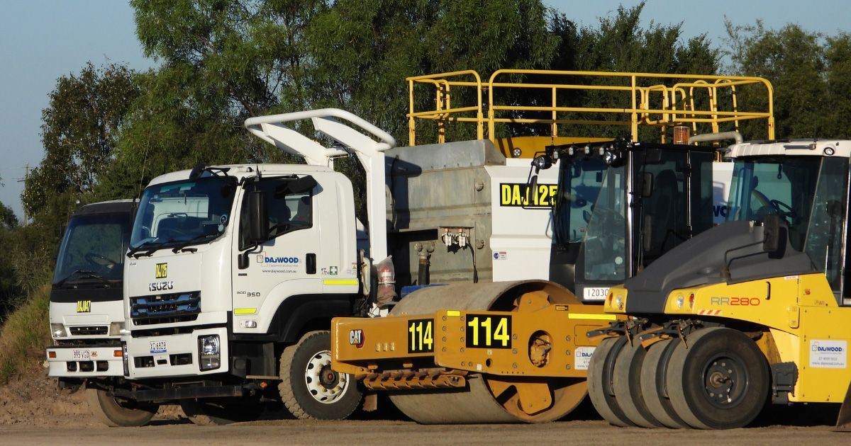 A mack truck is being loaded with water
