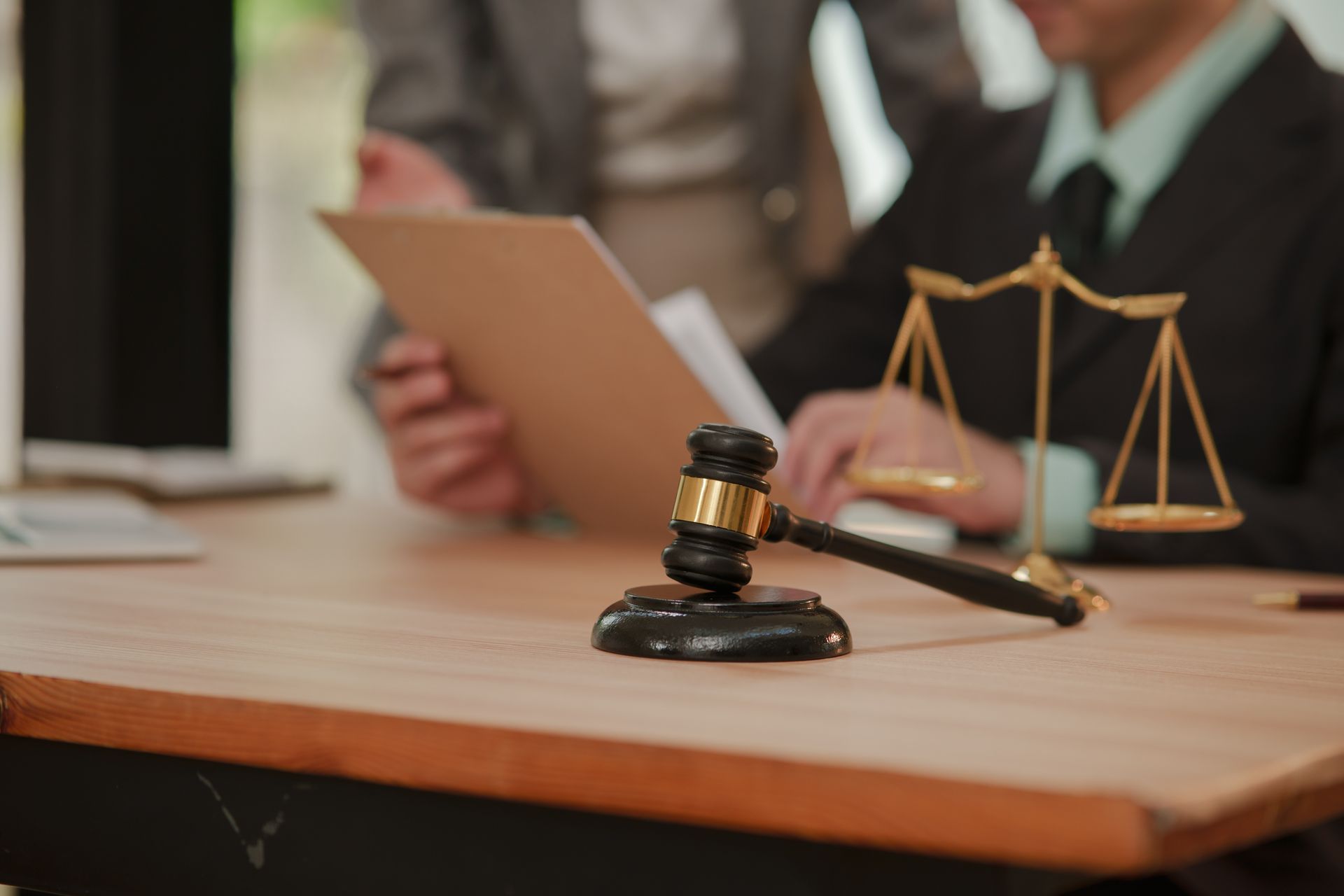 Trusts lawyer reviewing trust and estate planning documents with clients. Trusts lawyer reviewing trust and estate planning documents with clients.