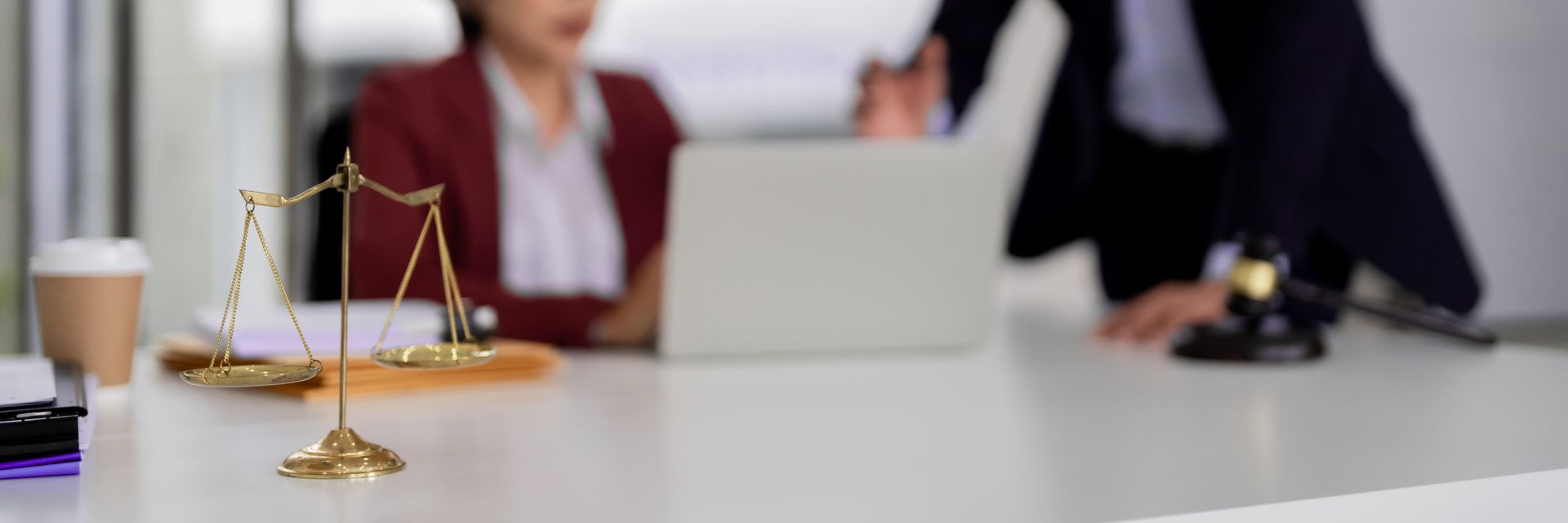 Close-up of scales of justice, symbolizing the expertise of a professional trusts attorney.