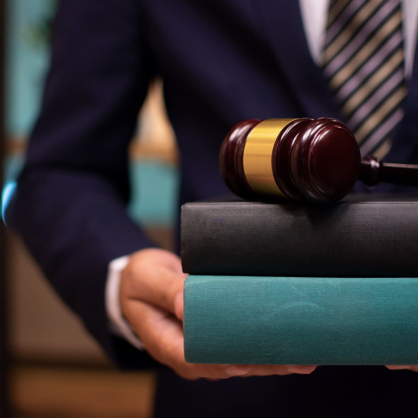 Lawyer Holding Books — Charlottesville, VA — Skeen Law Offices