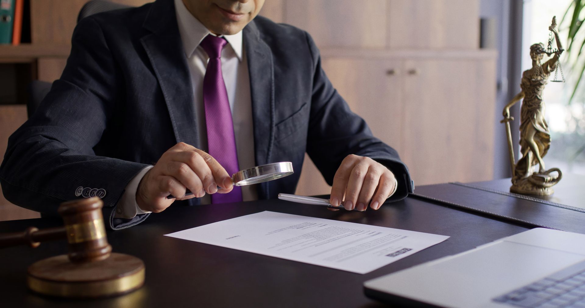 Legal consultant lawyer reviewing the official documents. Legal consultant lawyer reviewing the official documents.