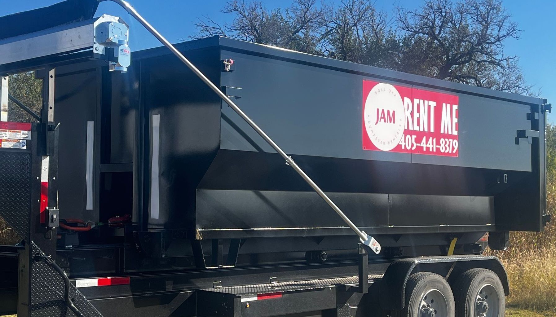 A dumpster with the word JAM on it