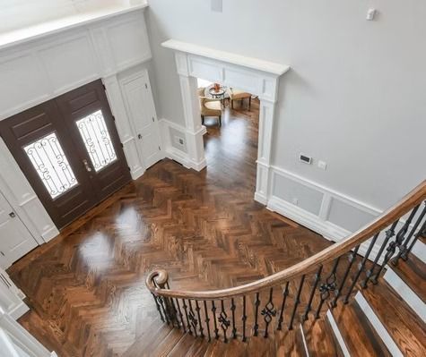An aerial view of a wooden staircase in a house