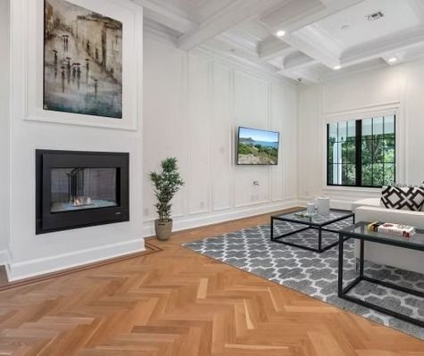 There is a fireplace in the middle of the living room.