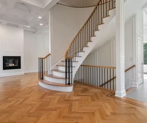 There is a spiral staircase in the middle of the room.