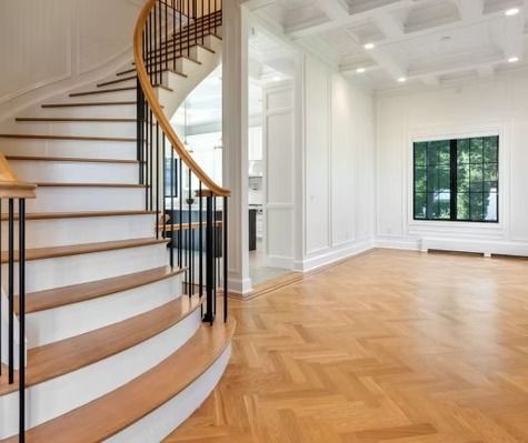 There is a spiral staircase in the middle of the room.