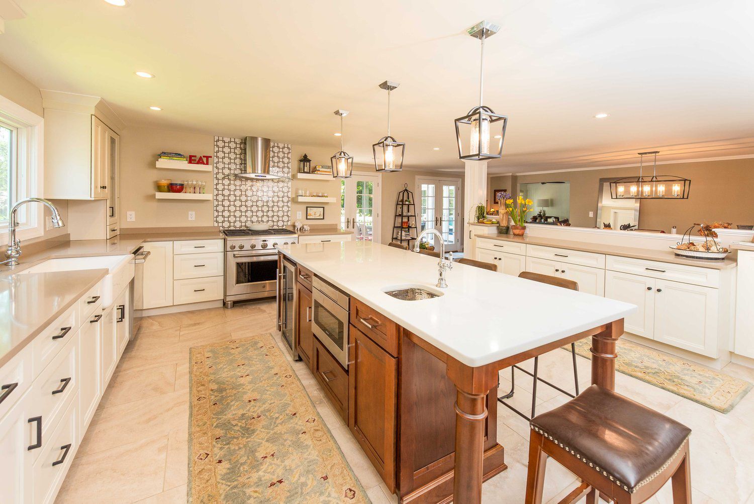 There is a large island in the middle of the kitchen.