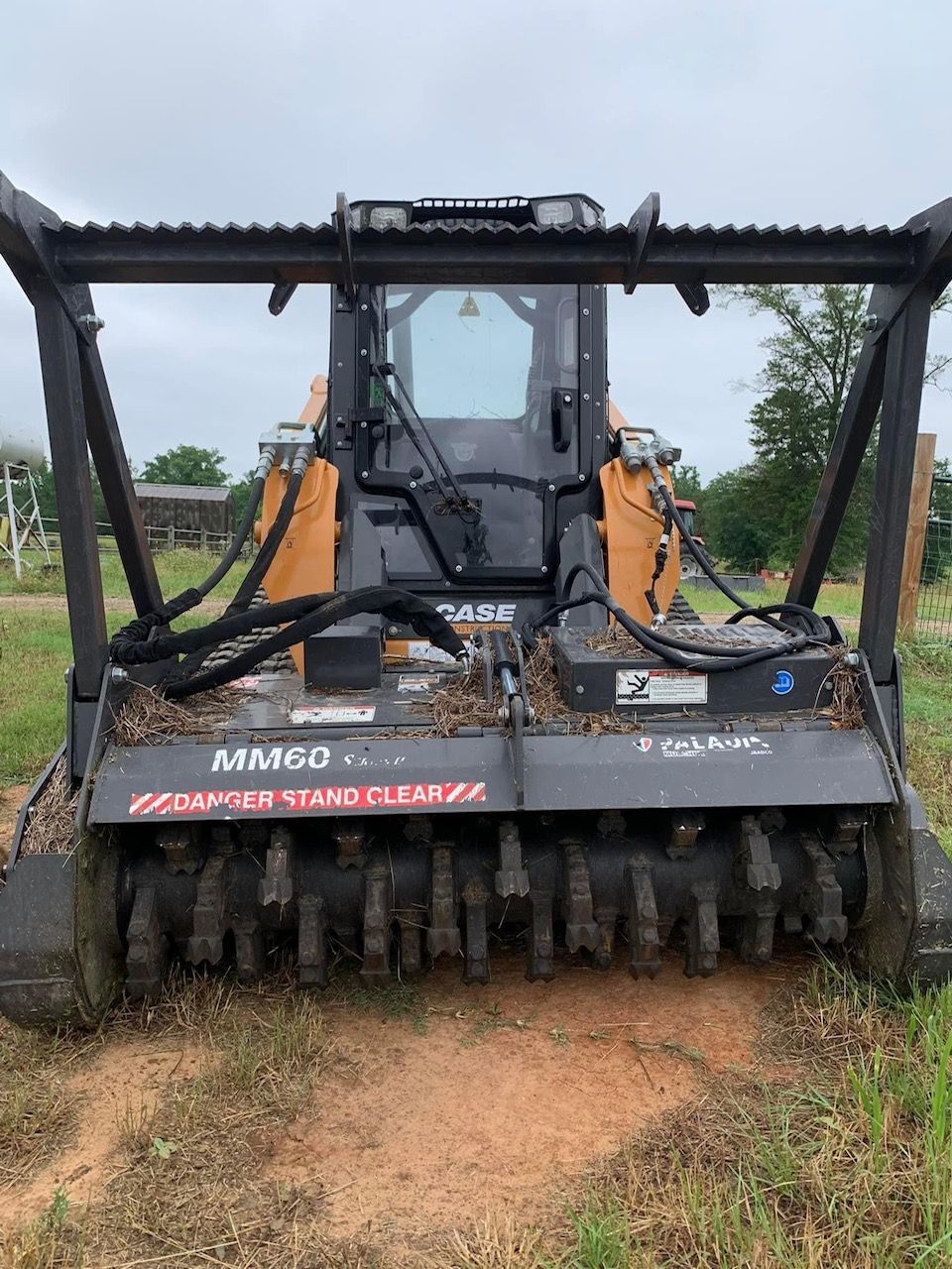 A large tractor is sitting in the middle of a field.