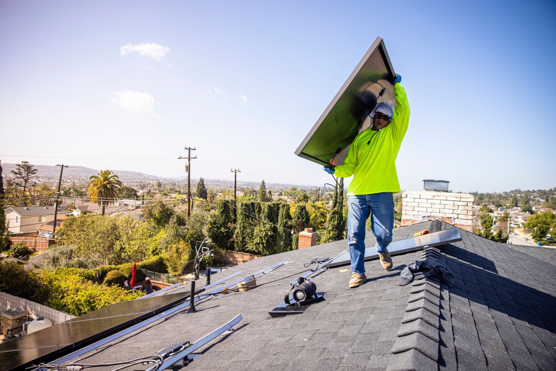 Guy Lifting Roof Replacement — Novato, CA — Quevedo Roofing