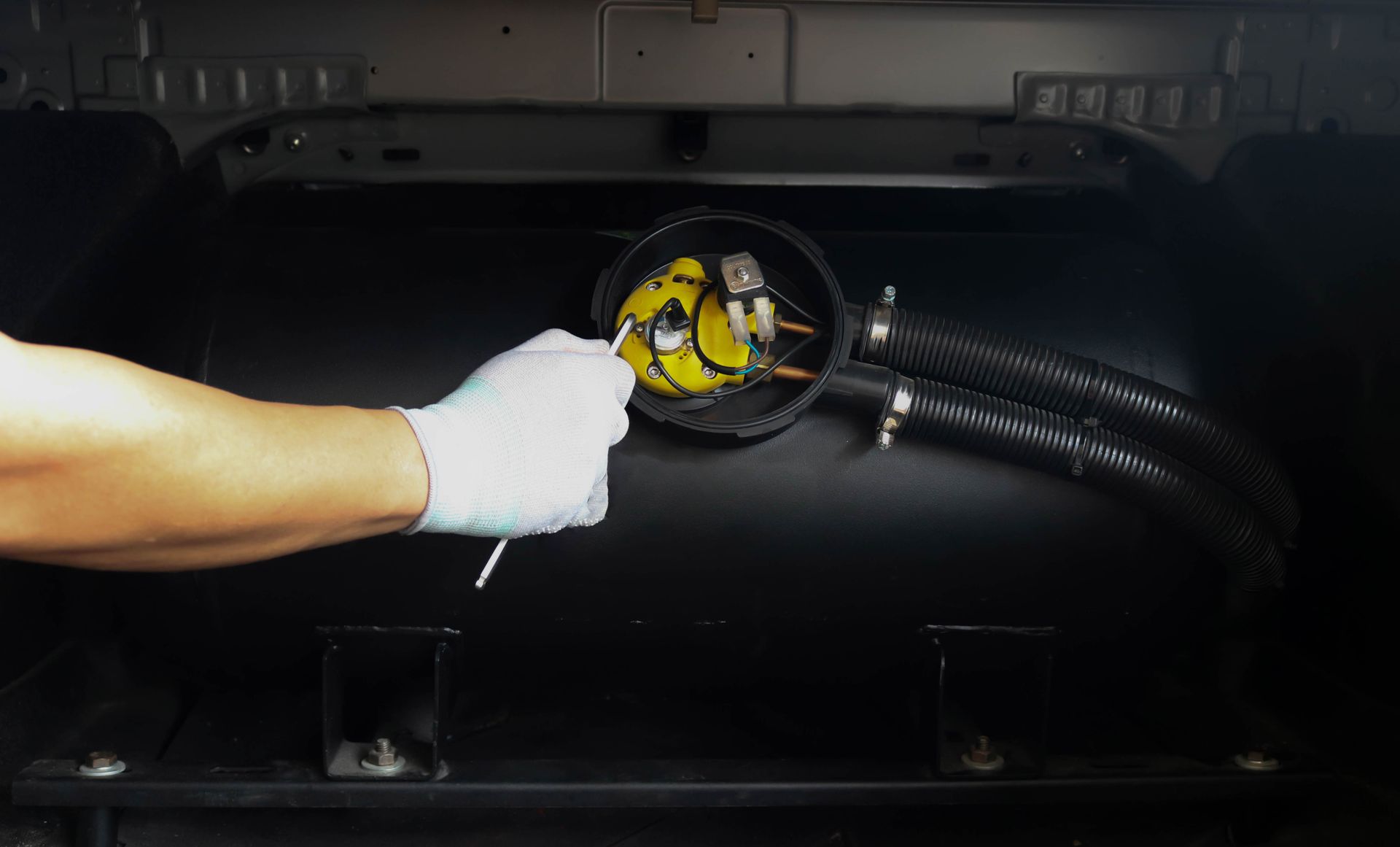 A Gloved Hand Uses a Probe to Inspect the Connection — A & D Automotive Technicians in Mackay, QLD