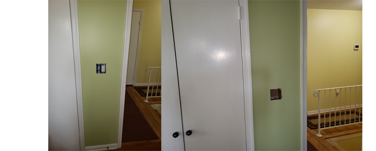 White closet doors with a glimpse of stairs and green walls.