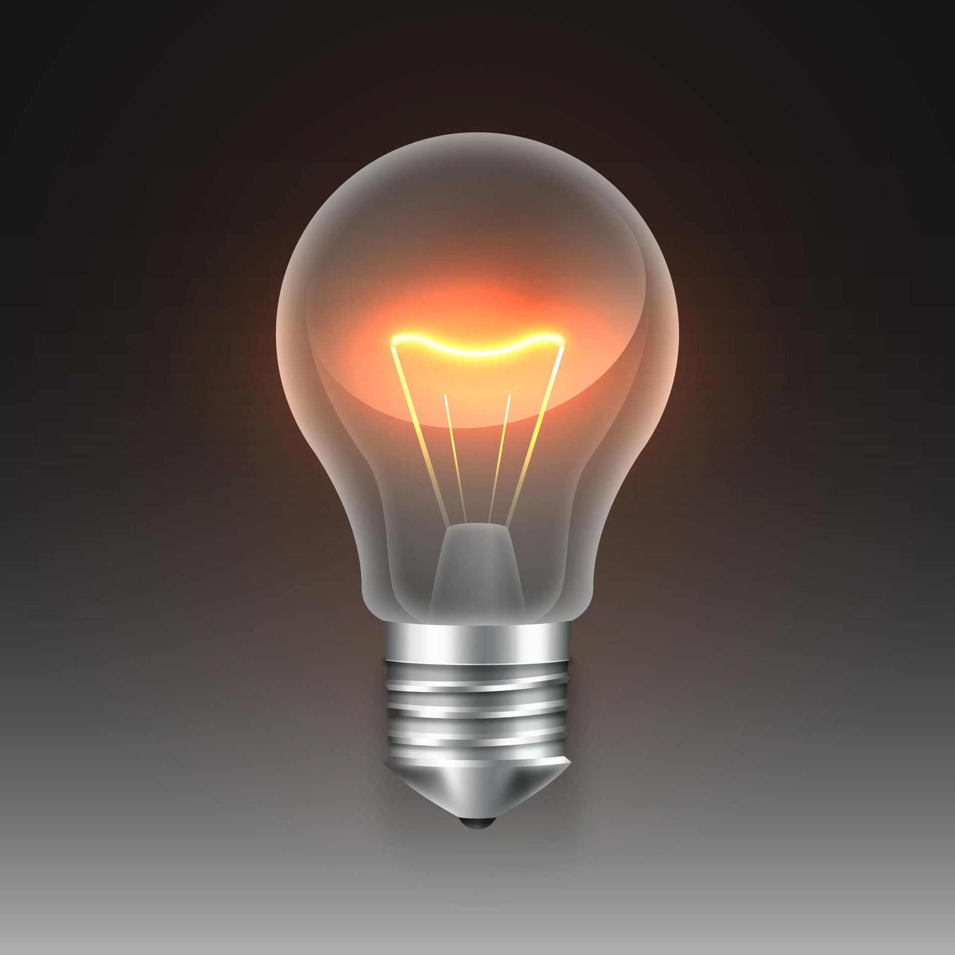 Lit incandescent lightbulb on a dark background; orange glow illuminates filament.