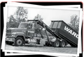 A black and white photo of a ward dump truck