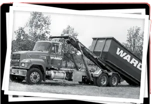 A black and white photo of a ward dump truck