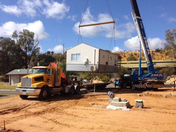 portable school being lifted
