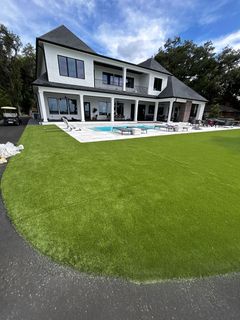 A close up of a soccer field with a white line in the grass.