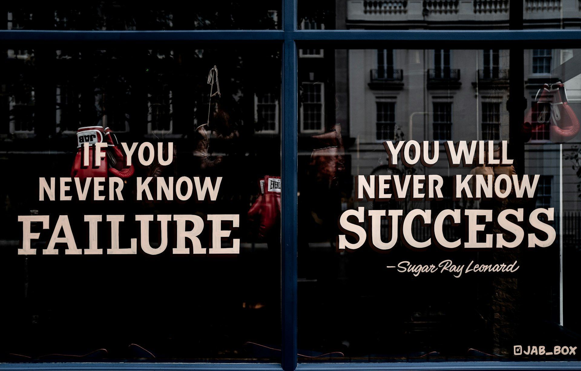 A window with a quote on it that says `` if you never know failure , you will never know success ''.