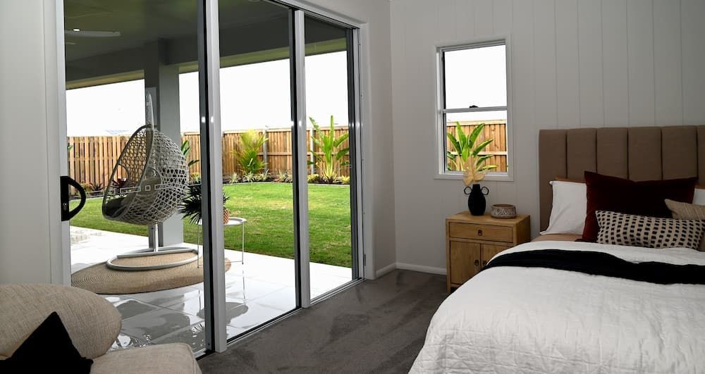 Bedroom With View of Outdoor Backyard- Windows & Doors in Townsville, QLD
