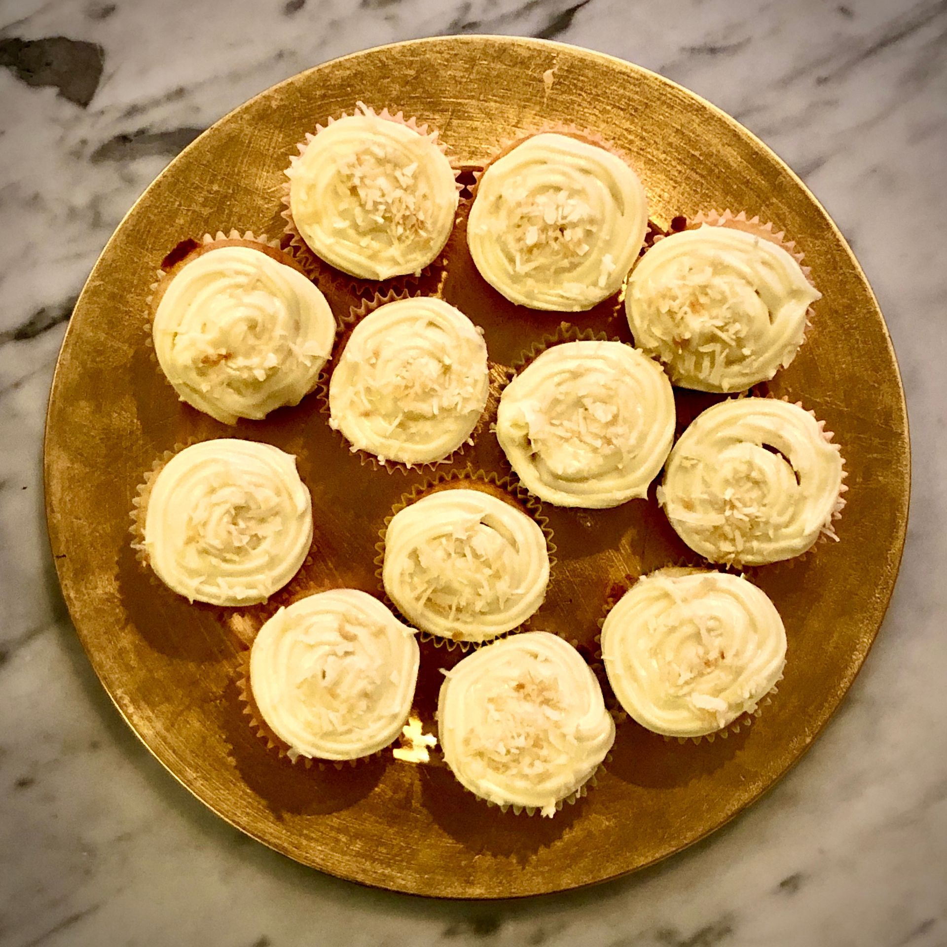 Cupcakes with vanilla frosting and coconut