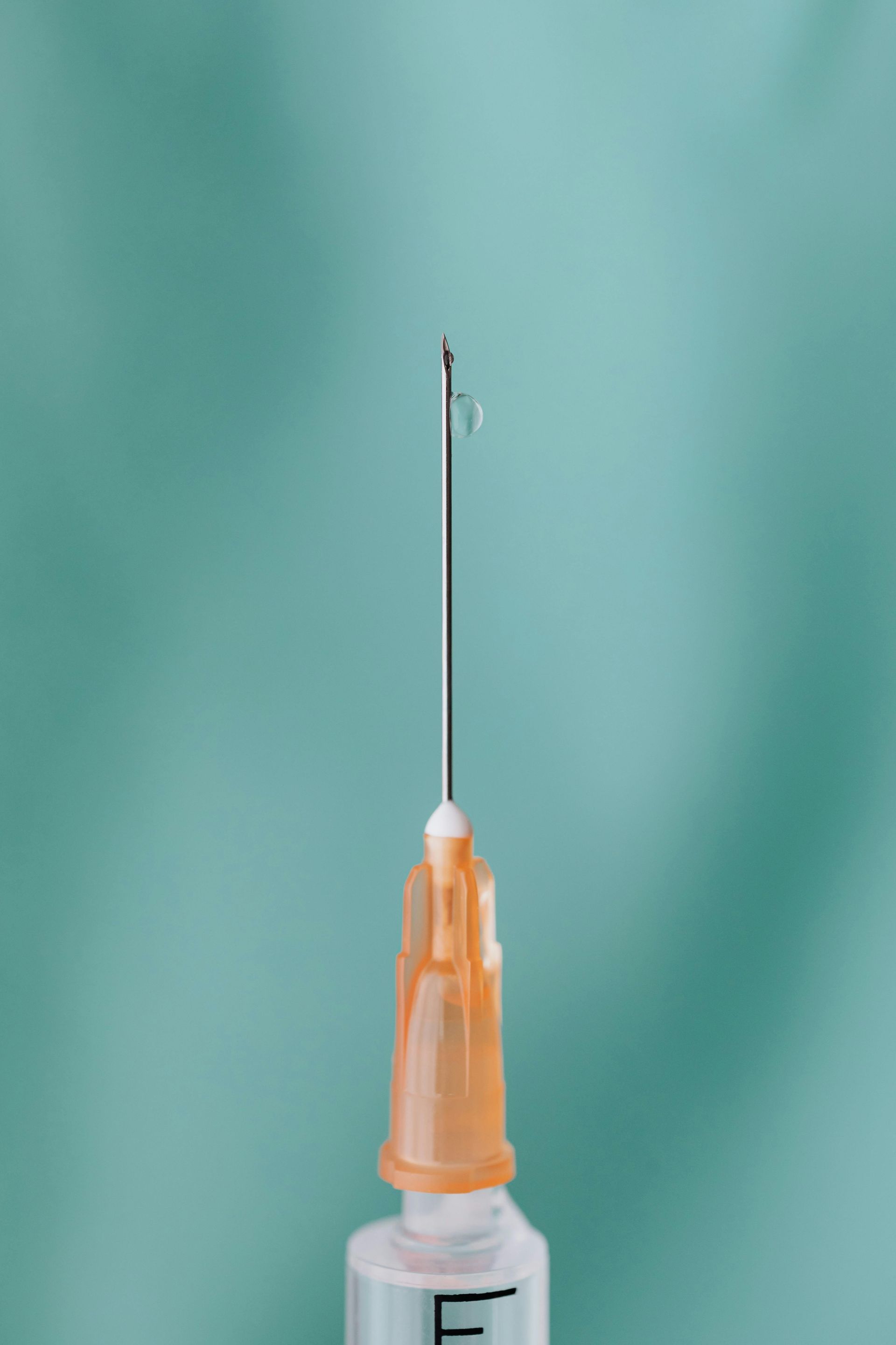 A syringe in a blue background. 