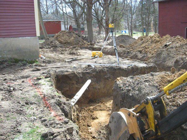 Digging Drainage — Kent City, MI — Summit Construction, Inc.— Kent City, MI — Summit Construction, Inc.