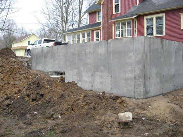 Digging Concrete Foundation — Kent City, MI — Summit Construction, Inc.— Kent City, MI — Summit Construction, Inc.