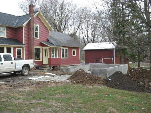 Red House with Lawn — Kent City, MI — Summit Construction, Inc.— Kent City, MI — Summit Construction, Inc.