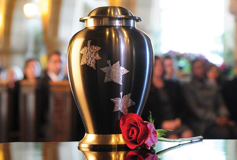 urn with leaves on it 