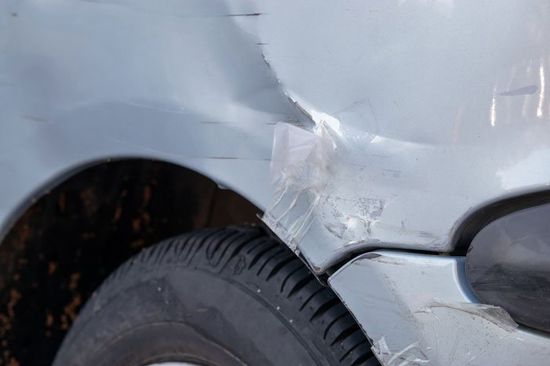 Damaged bumper on a grey car — Pittsfield, MA — Mom's Auto Sales and Associated Autobody Rebuilders