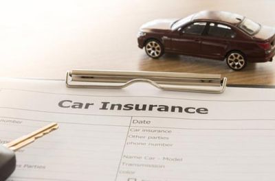 Teen Car Insurance — Car Insurance Form and a Toy Car in Gallup, NM