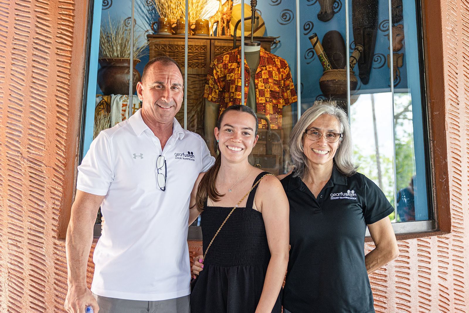 A man and two women are posing for a picture.