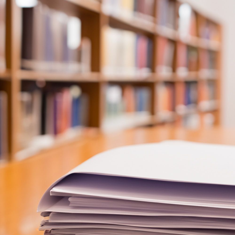 Papers sitting on a table in the library