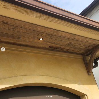 A close up of a wooden ceiling on a building