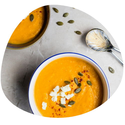 A plate of food with a bowl of dipping sauce on the side.