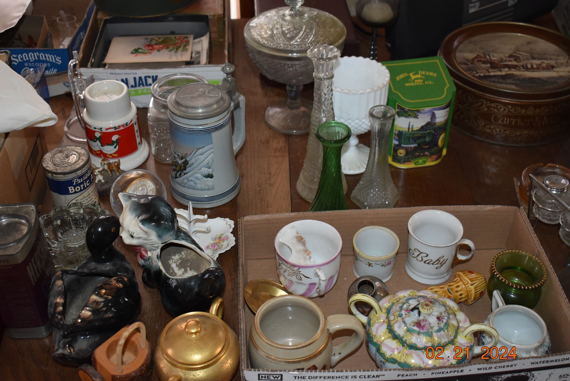 Antique glass mugs and figures.
