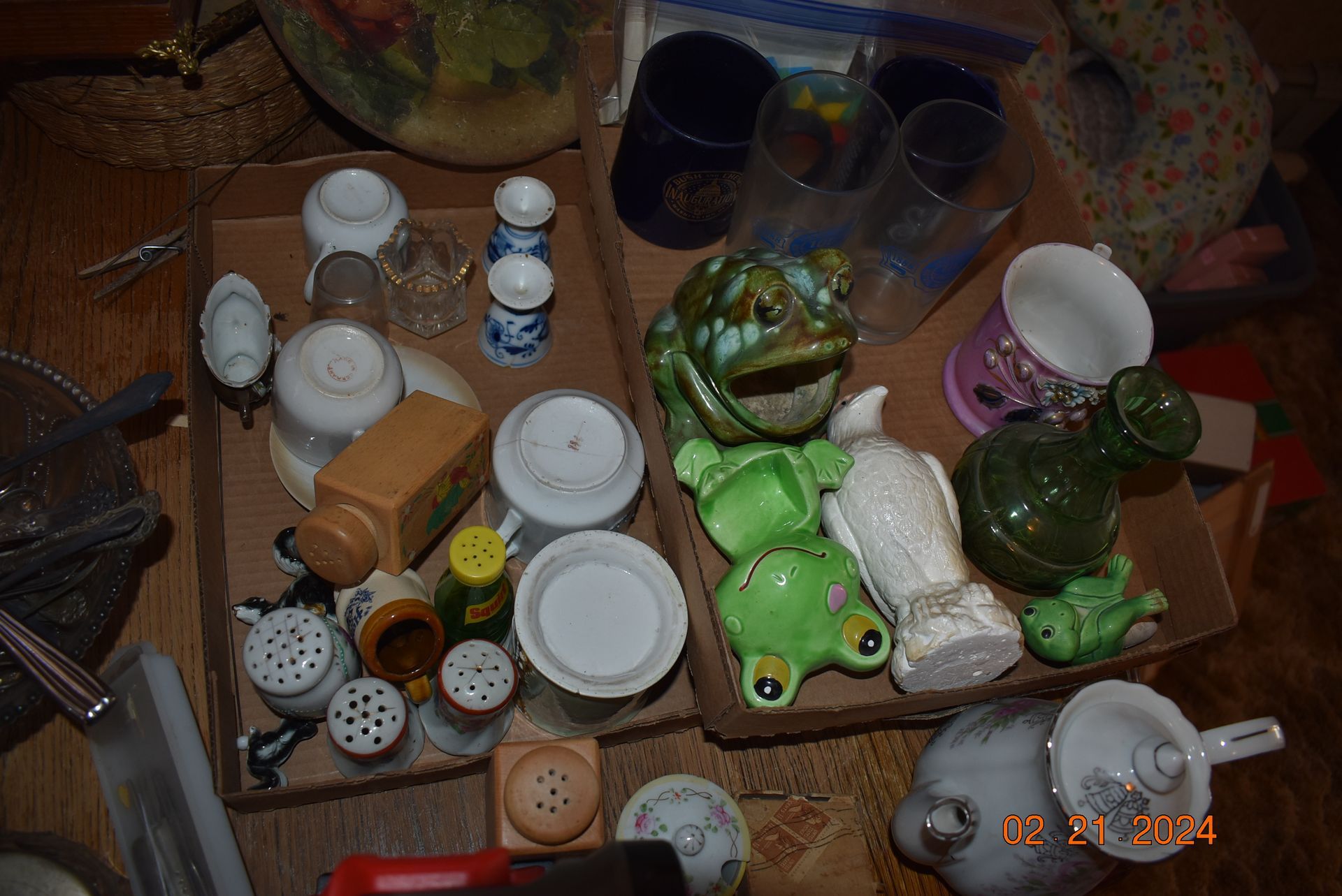 Antique glass salt and pepper shakers with glass figures.