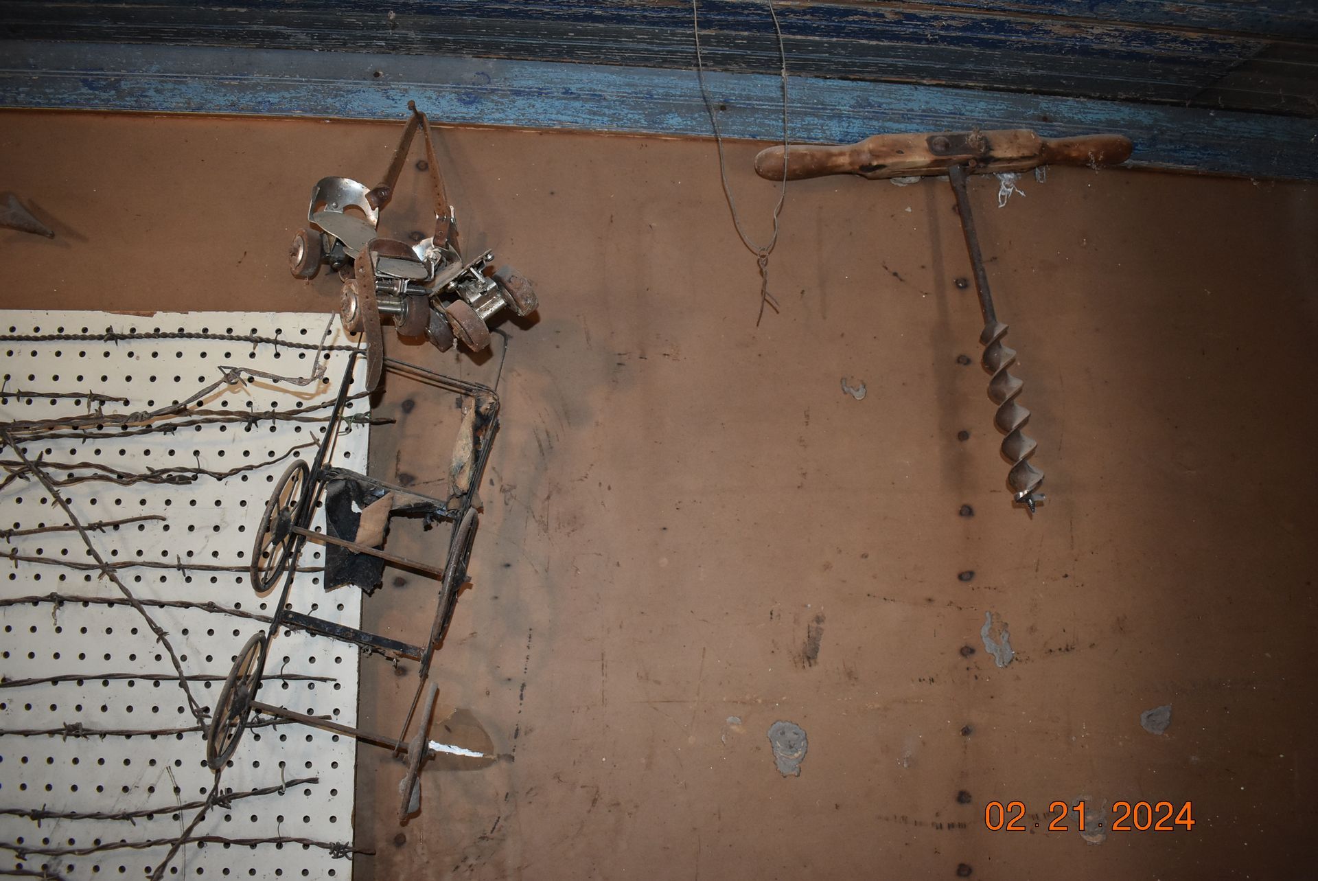 skates with a hand drill and wire baby cart.