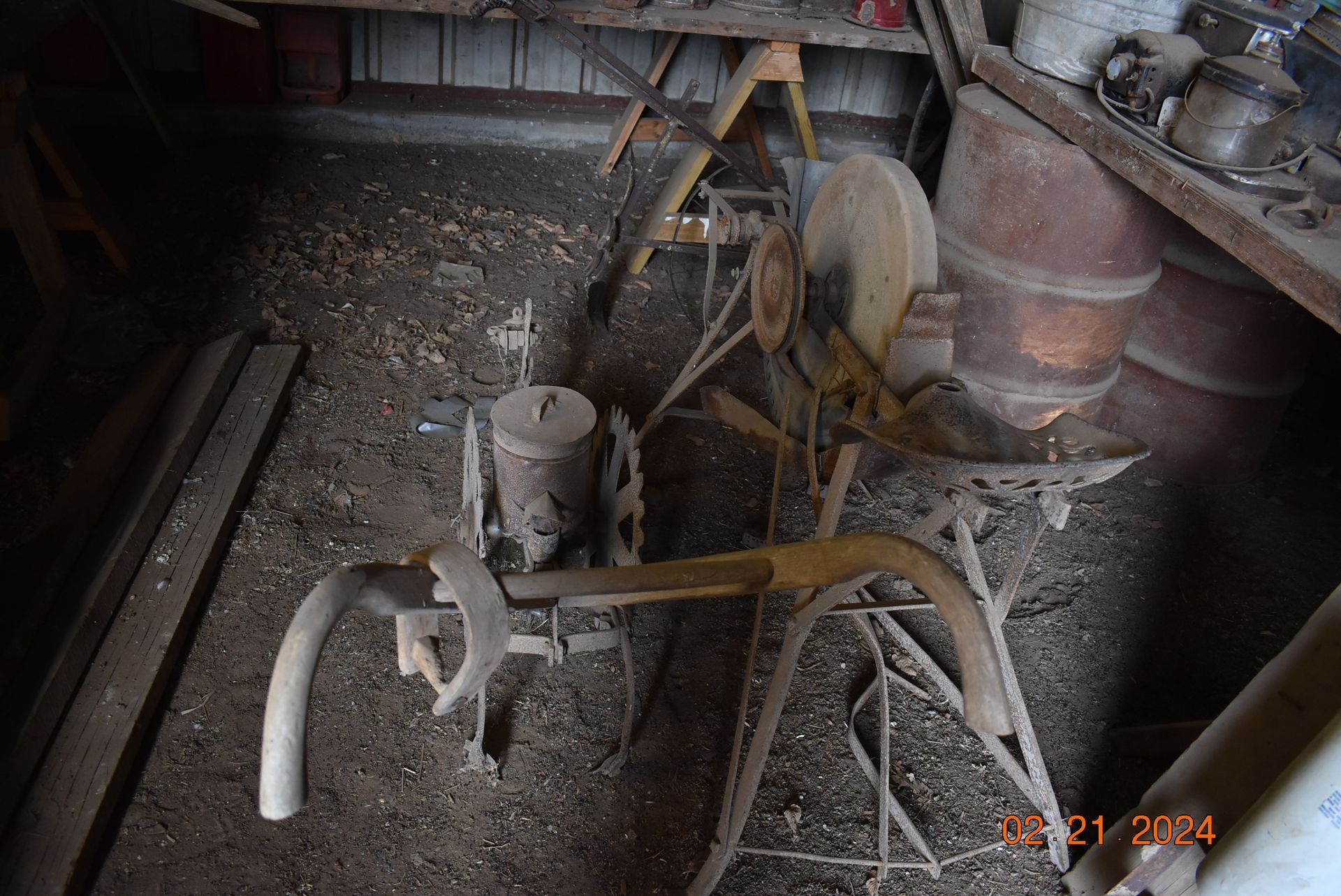 Old farm hoo and old blade sharpener