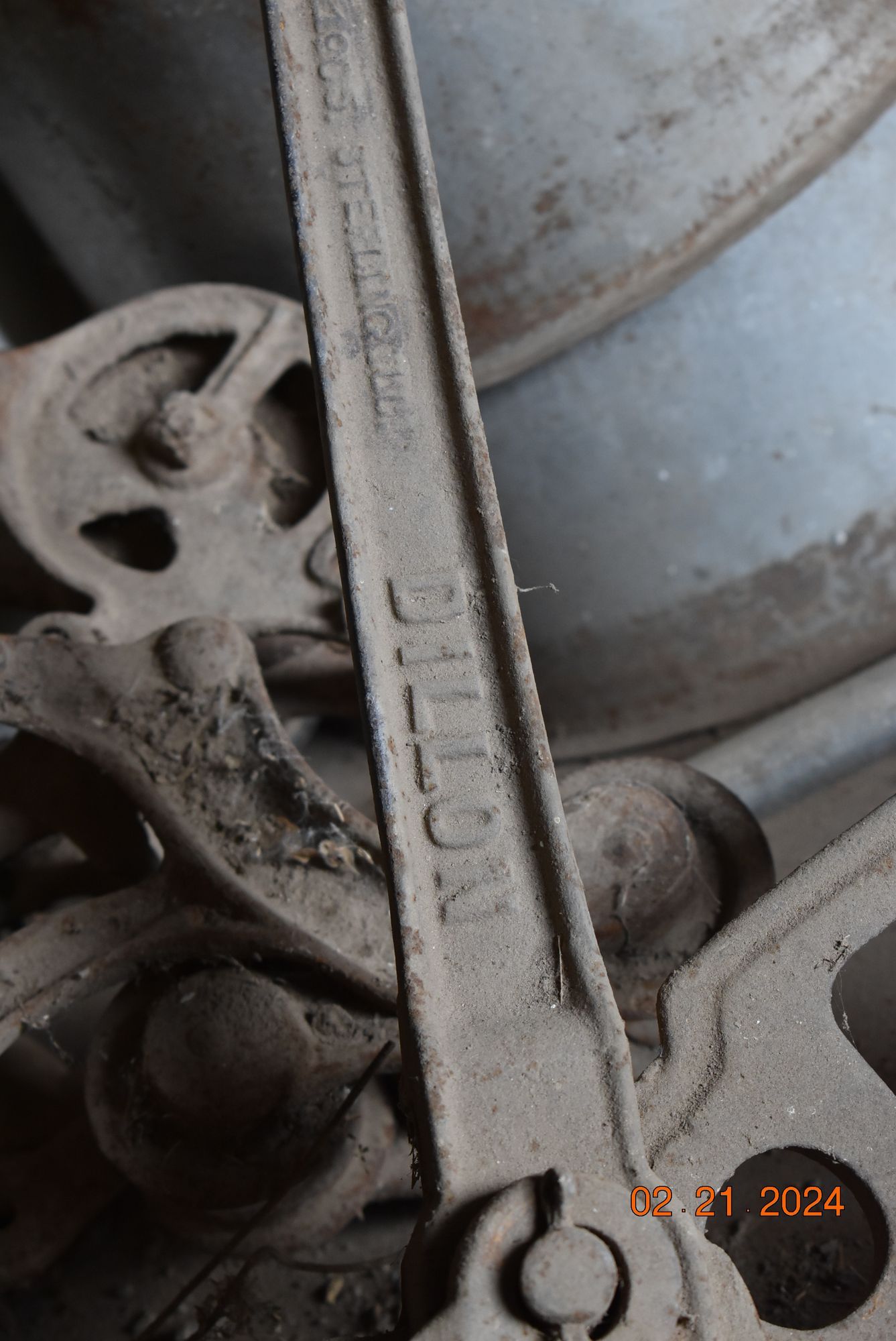 a close up of a piece of metal with the word Dillon