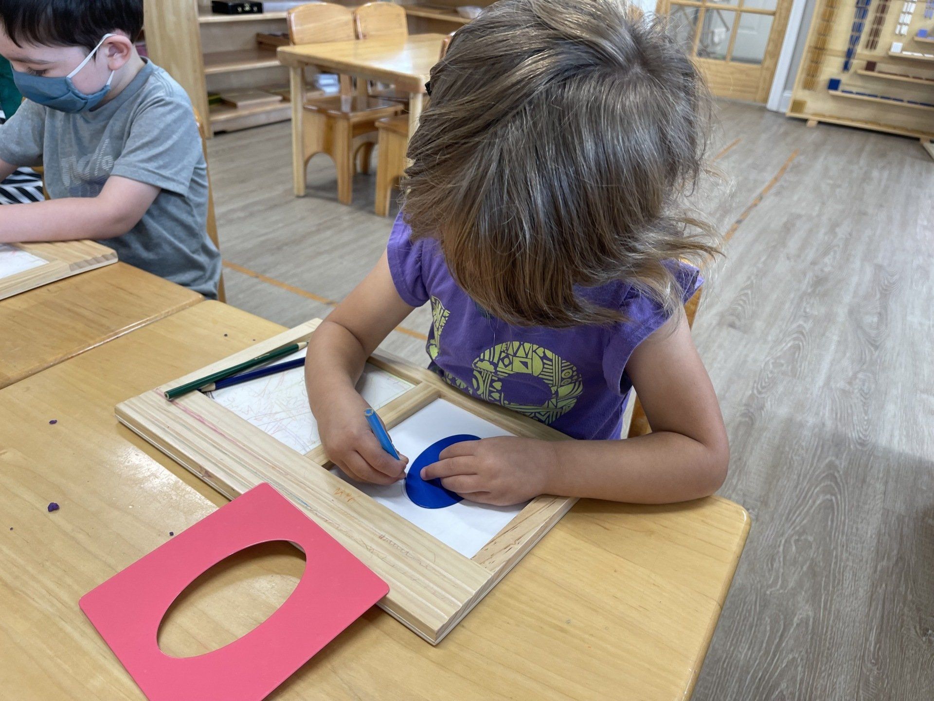 Montessori child working in the classroom 