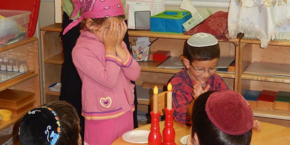 Montessori children working on Hebrew studies