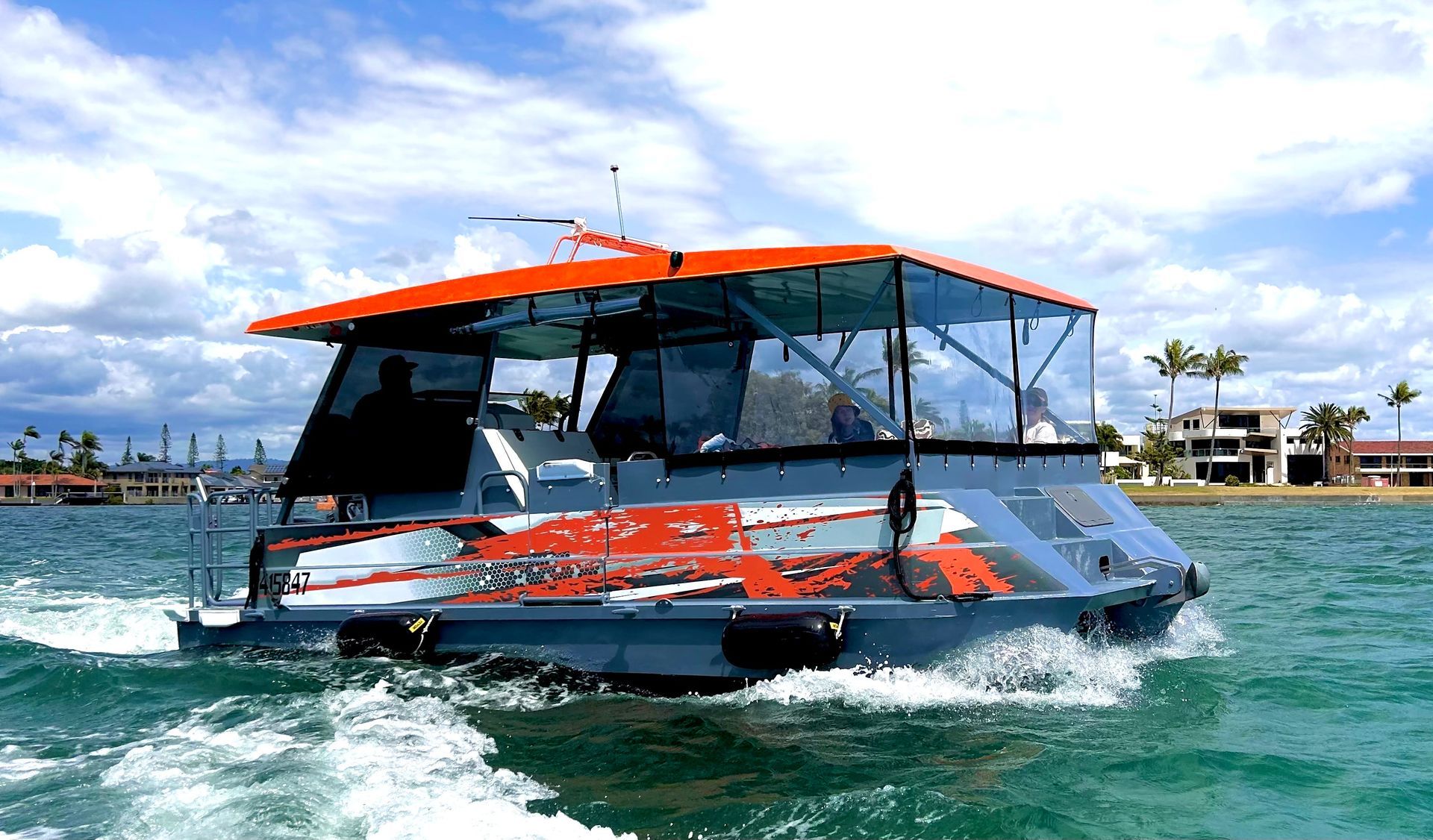 A boat is floating on top of a body of water.