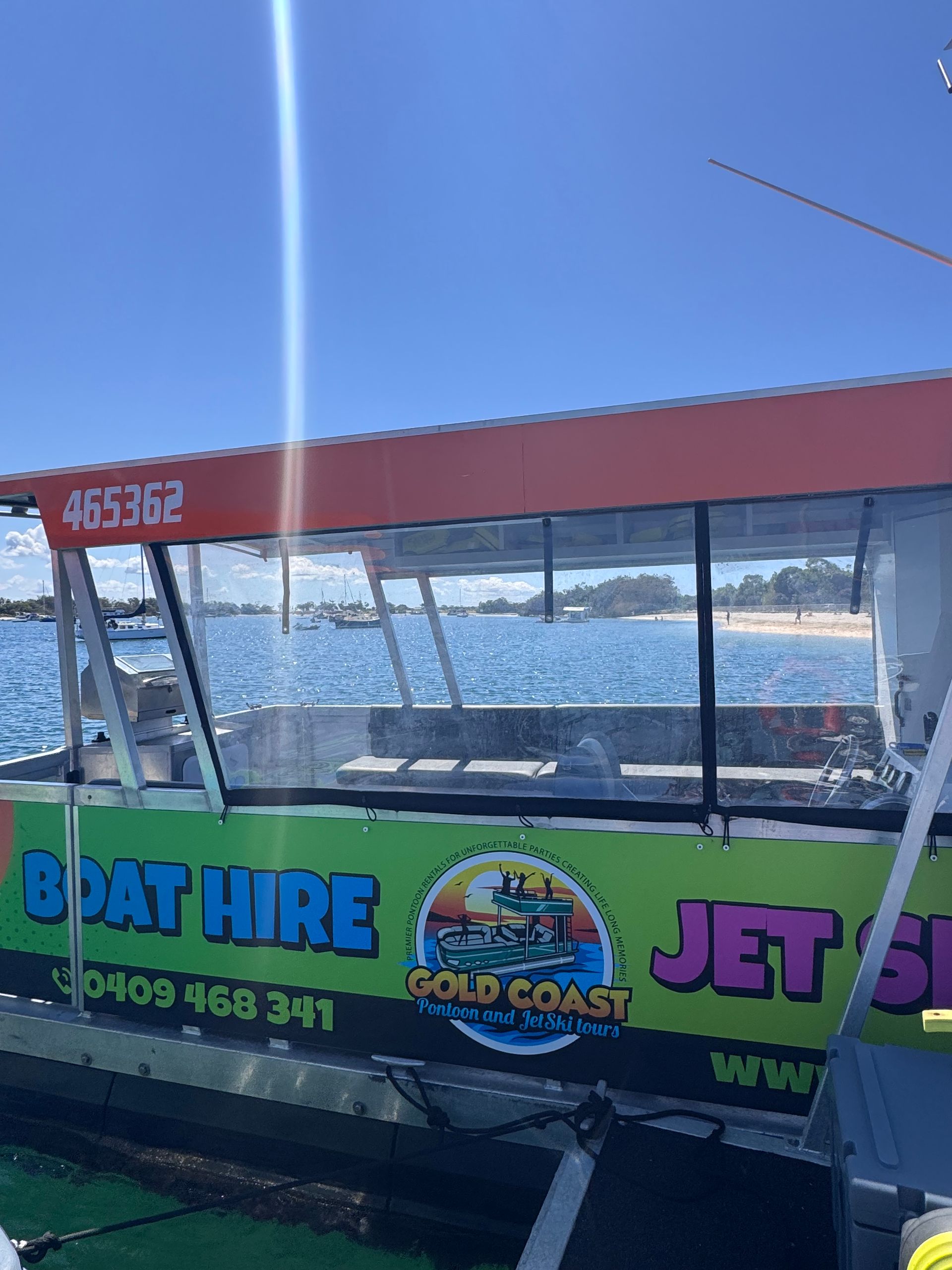 A boat is floating on top of a body of water.
