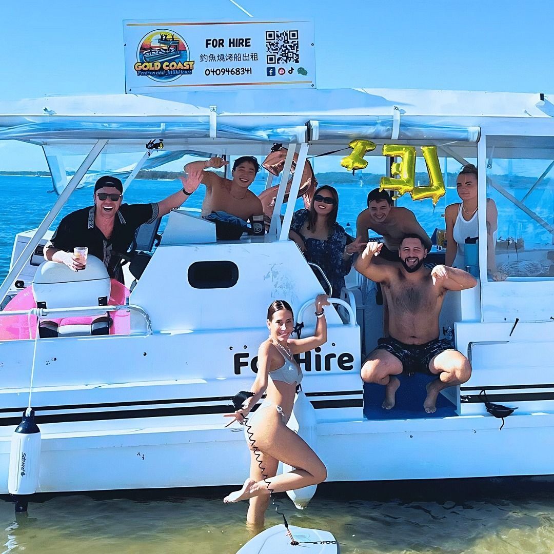 A group of people are posing for a picture on a boat that says for hire