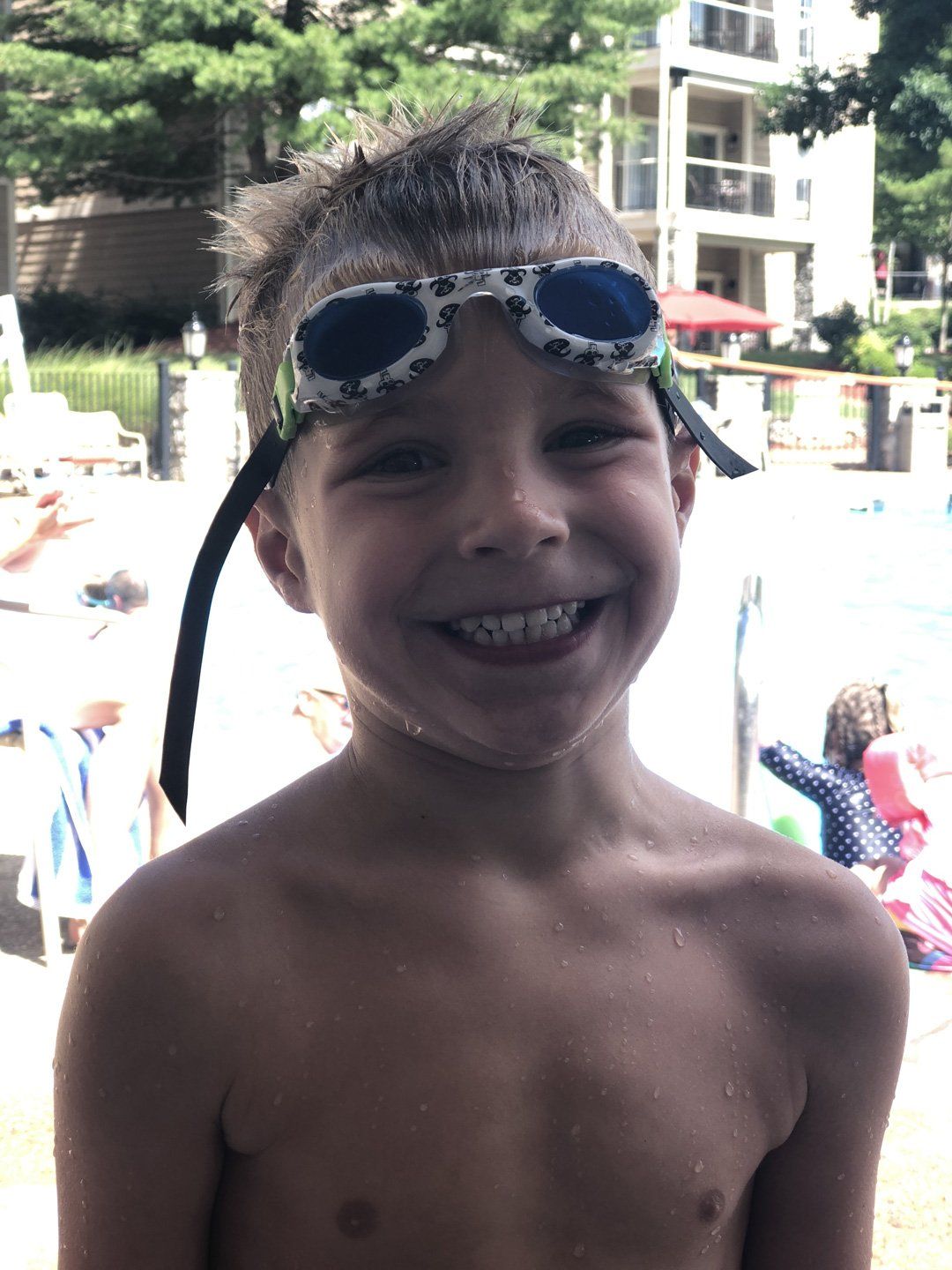 kid with goggles smiling