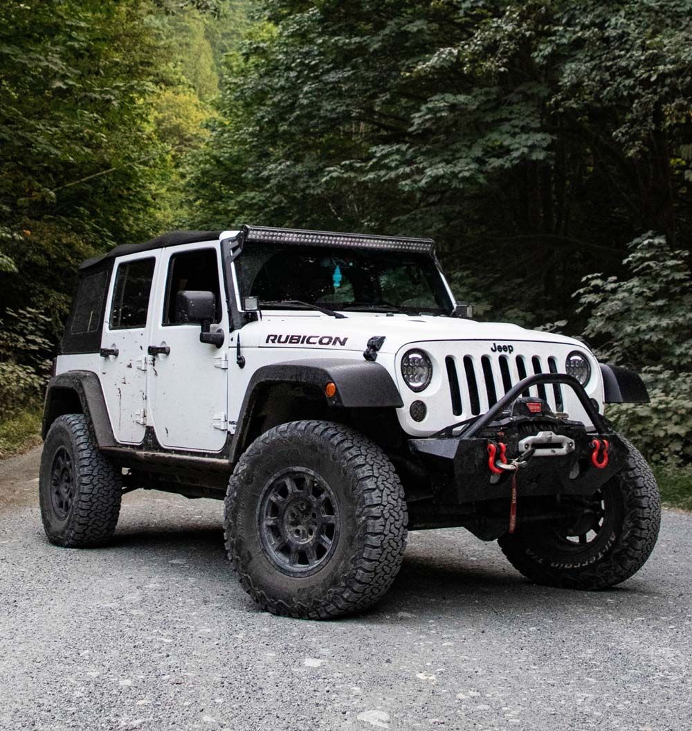 A White And Black Vehicle With Tint